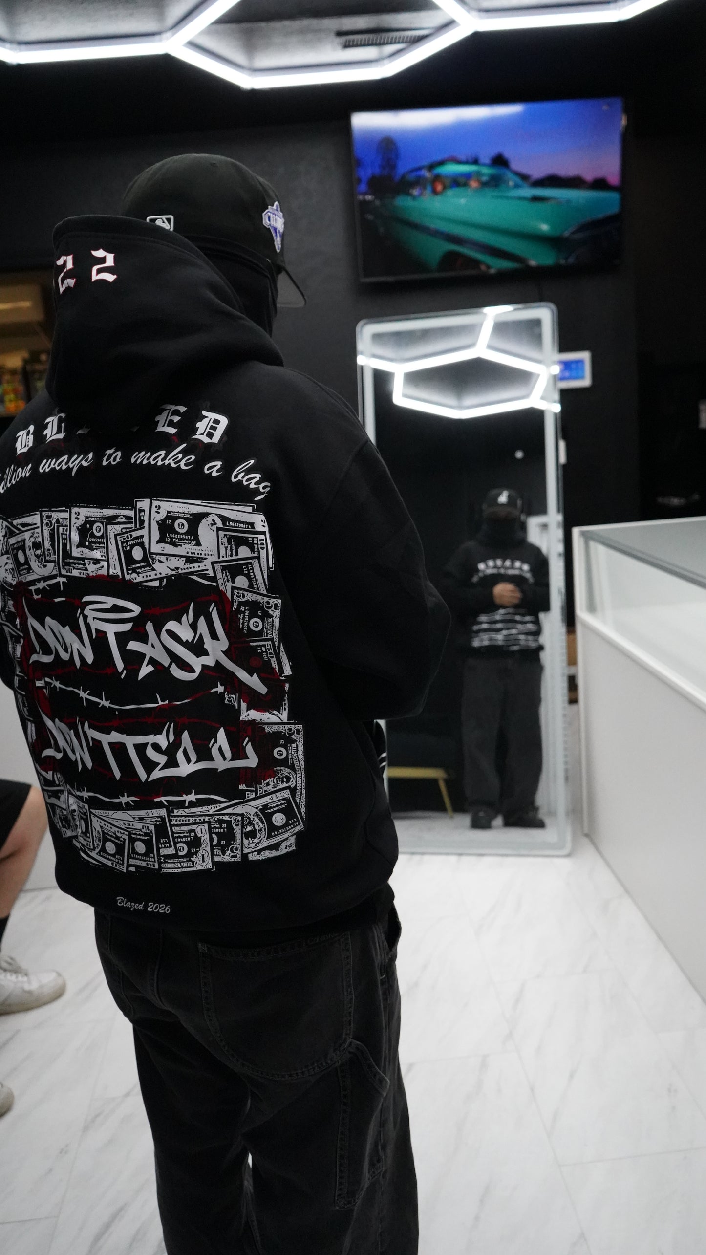 "Million ways to make a Bag." Hoodie with Mask